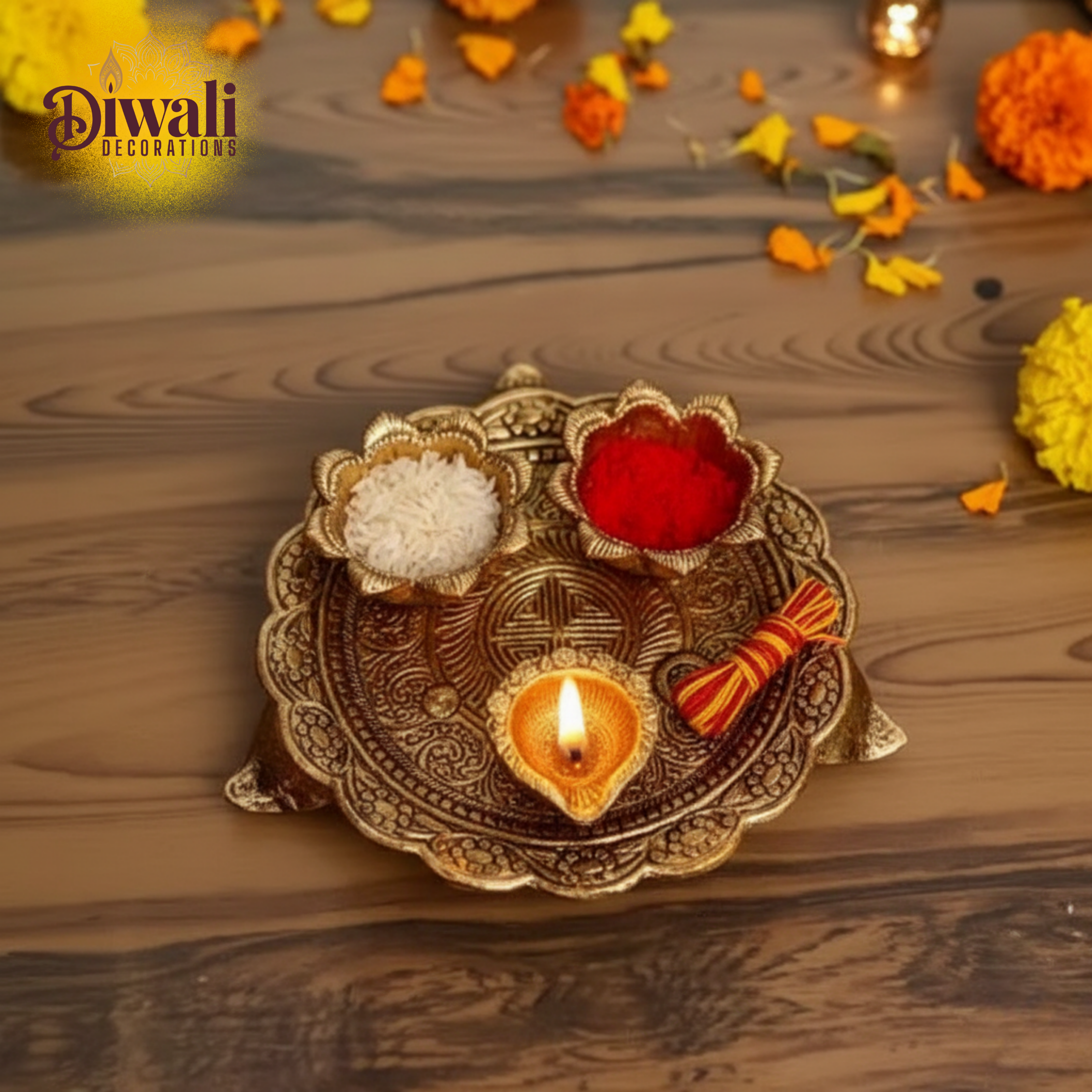 Decorative Diwali lamp with lit candle on a wooden surface, surrounded by flowers.