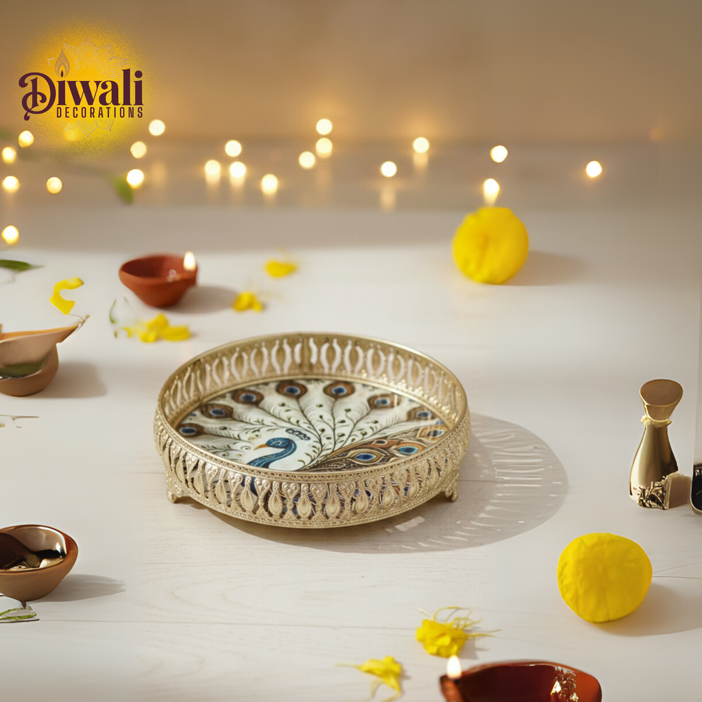 Decorative peacock tray with Diwali decorations on a white surface.