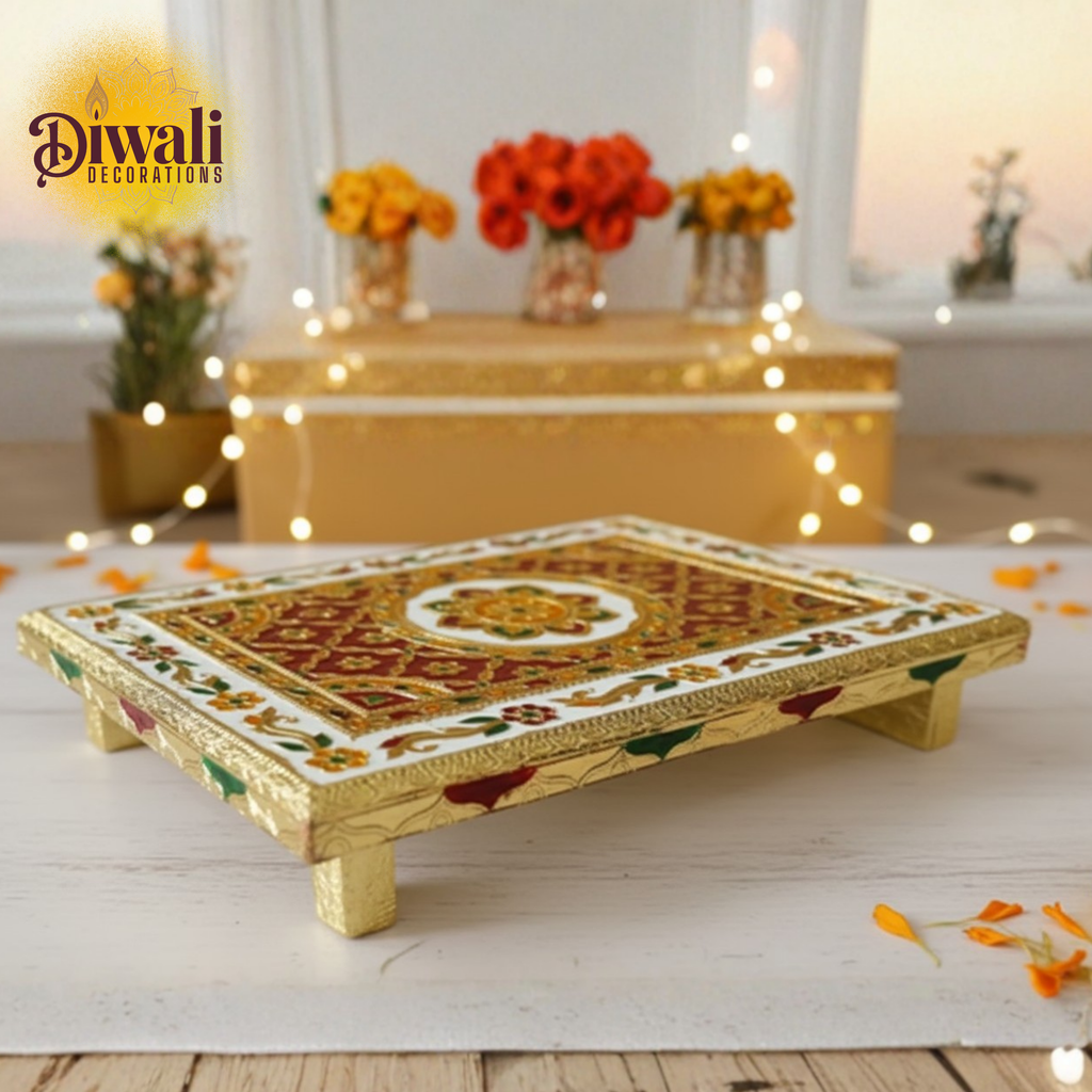 Decorative wooden tray with intricate designs on a Diwali-themed setting with flowers and lights.