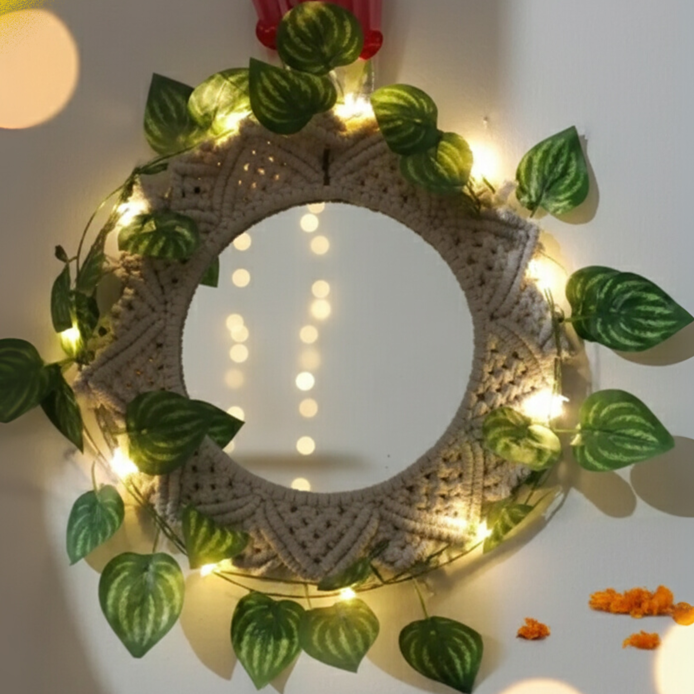 Decorative wreath with lights and leaves on a blurred background with 'Diwali Decorations' text.